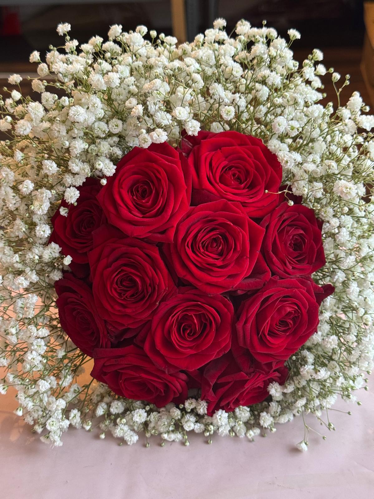 Bouquet of red roses with white baby's breath flowers